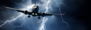 Jet travelling through stormy sky