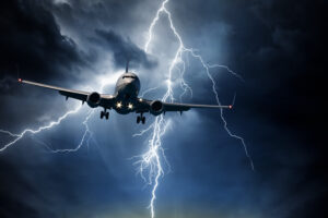 Jet travelling through stormy sky